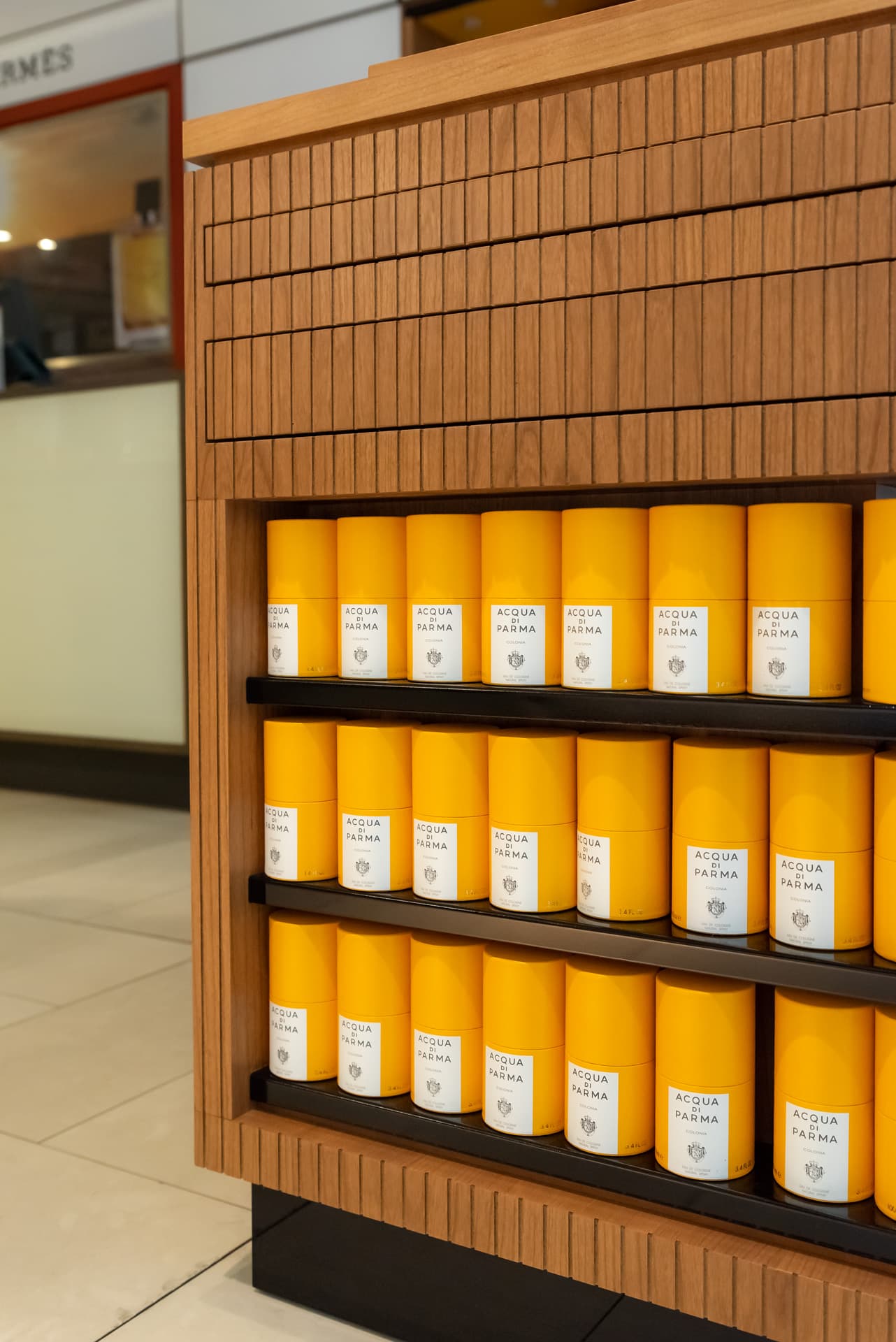 Aqua di Parma products on a wooden shelf